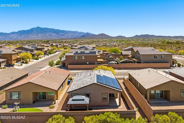 aerial view featuring a mountain view and a residential view