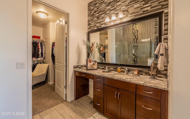 13274 Humphreys Peak Dr, Oro Valley, AZ 85755 - full bathroom with baseboards, a shower stall, vanity, and tasteful backsplash