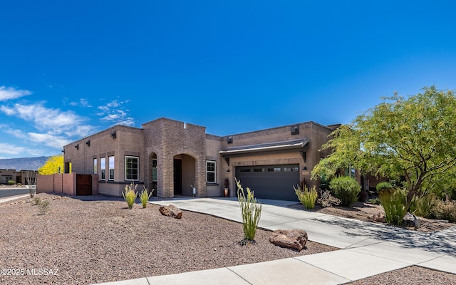 13274 Humphreys Peak Dr, Oro Valley, AZ 85755 - view of front of house with driveway, fence, stucco siding, and an attached garage
