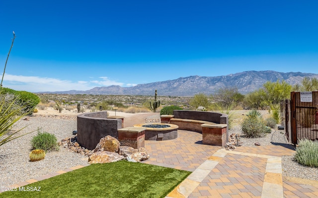 13274 Humphreys Peak Dr, Oro Valley, AZ 85755 - view of patio / terrace with an outdoor fire pit and a mountain view