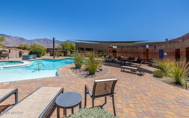 13274 Humphreys Peak Dr, Oro Valley, AZ 85755 - view of swimming pool featuring a patio, a mountain view, fence, and a pool with connected hot tub
