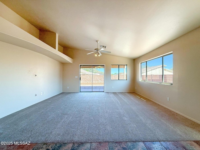 2582 W Brandy Crest Dr, Tucson, AZ 85713 - carpeted spare room featuring vaulted ceiling, healthy amount of natural light, a ceiling fan, and baseboards
