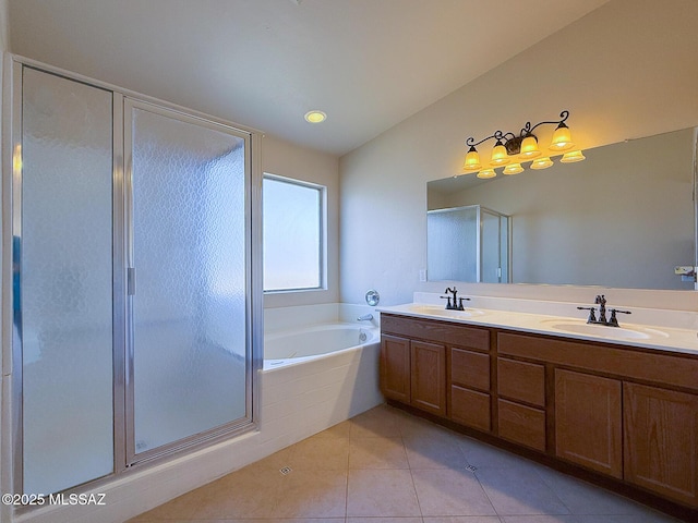 2582 W Brandy Crest Dr, Tucson, AZ 85713 - bathroom featuring a bath, double vanity, a shower stall, tile patterned flooring, and vaulted ceiling