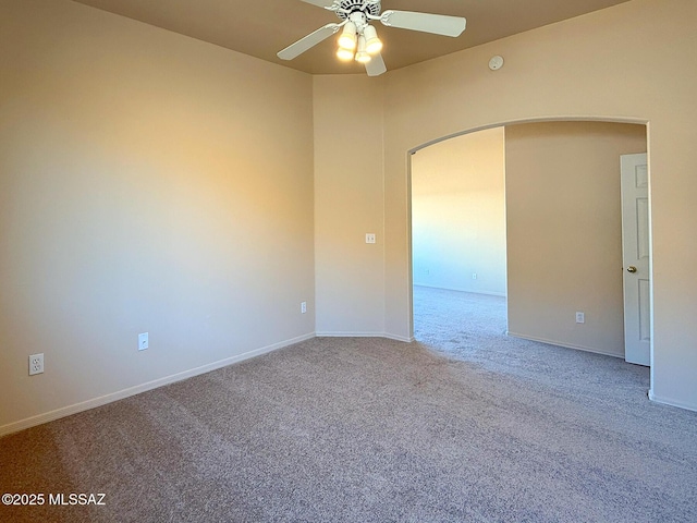 2582 W Brandy Crest Dr, Tucson, AZ 85713 - carpeted empty room featuring arched walkways, a ceiling fan, and baseboards