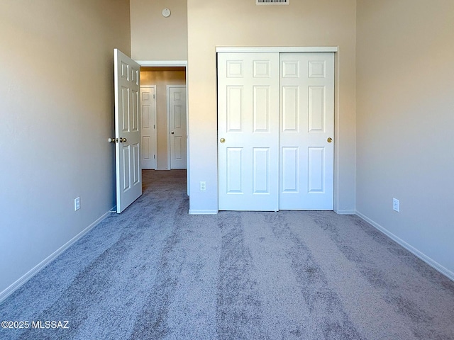 2582 W Brandy Crest Dr, Tucson, AZ 85713 - unfurnished bedroom with carpet flooring, baseboards, and a closet