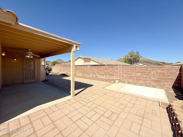 2582 W Brandy Crest Dr, Tucson, AZ 85713 - fenced backyard featuring a patio and a ceiling fan