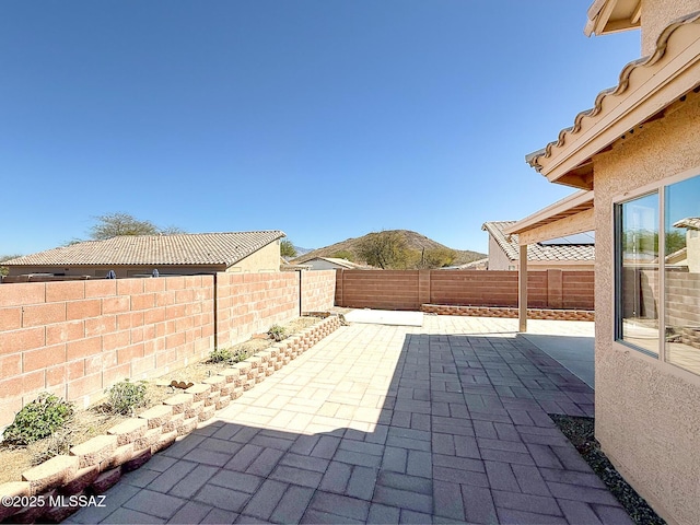 2582 W Brandy Crest Dr, Tucson, AZ 85713 - fenced backyard featuring a patio and a mountain view
