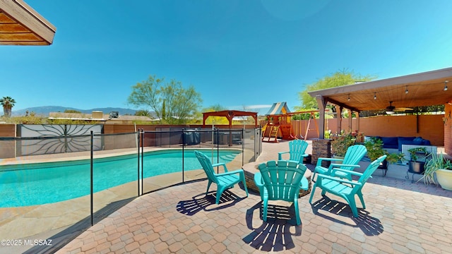 502 N Citadel Ave, Tucson, AZ 85748 - view of swimming pool with a fenced in pool, a playground, a fenced backyard, a patio, and a mountain view