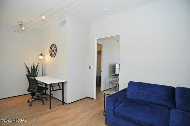 interior space featuring light wood-style floors and visible vents