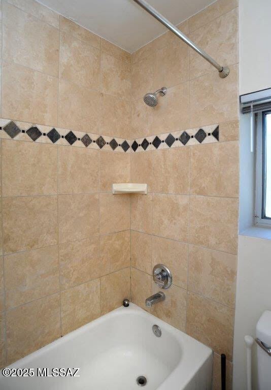 full bath featuring toilet and washtub / shower combination