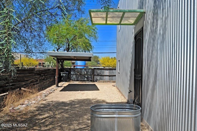 view of patio / terrace with fence and a gate