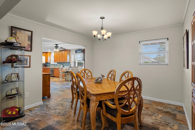 dining space with stone tile floors, crown molding, and baseboards