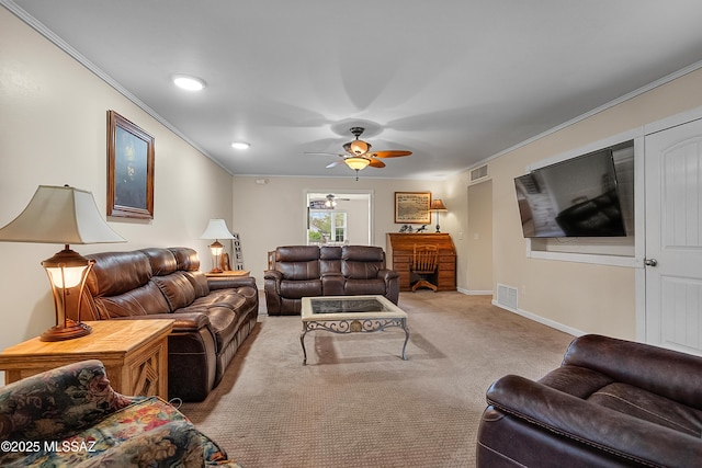 carpeted living room with visible vents, a ceiling fan, baseboards, and ornamental molding