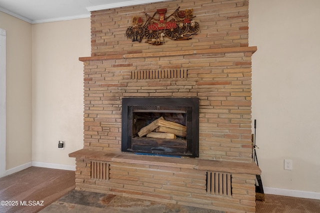 details featuring baseboards, crown molding, a large fireplace, and carpet