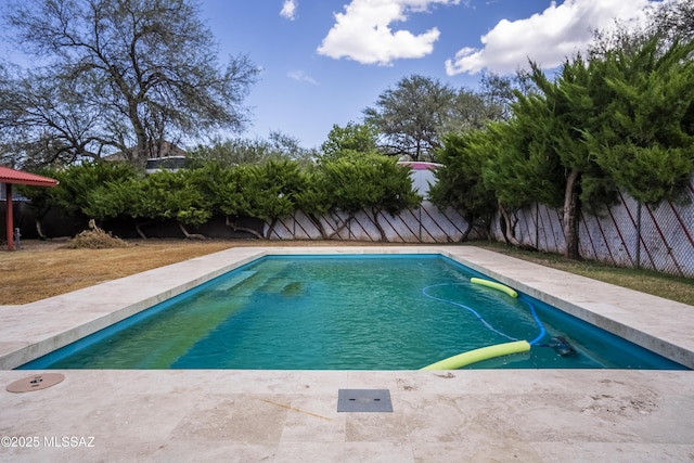 view of swimming pool with a fenced backyard and a fenced in pool