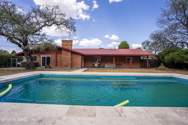 view of pool with fence and a fenced in pool