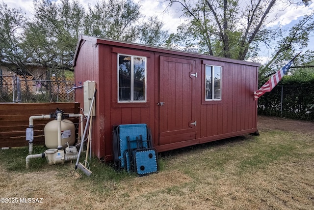 view of shed with fence