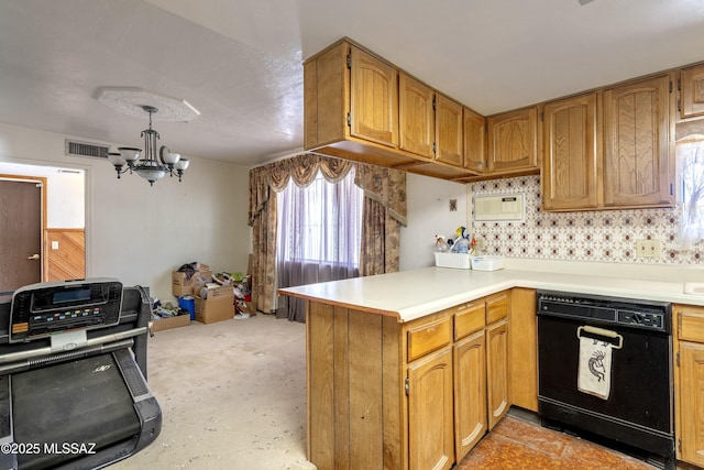 601 N Sahuara Ave, Tucson, AZ 85711 - kitchen with visible vents, a peninsula, black dishwasher, light countertops, and a chandelier
