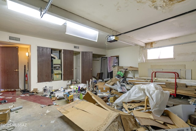 601 N Sahuara Ave, Tucson, AZ 85711 - garage with visible vents and a garage door opener