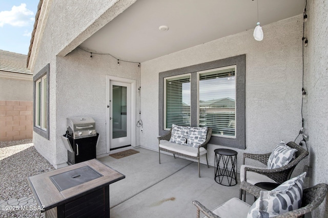 view of patio with fence and grilling area