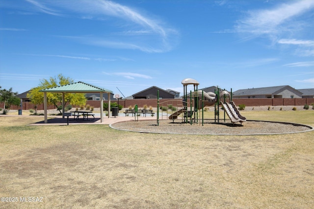 community play area featuring fence and a gazebo