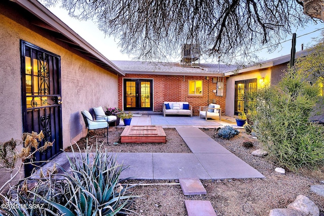 view of patio with outdoor lounge area and french doors