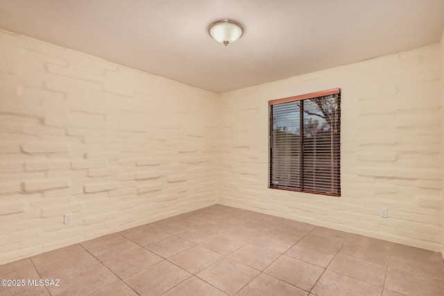 spare room with light tile patterned floors