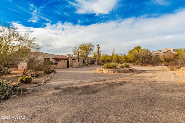 view of front of house with a storage unit and an outdoor structure
