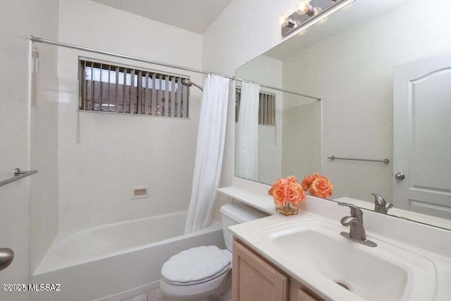 full bath with shower / bath combo, vanity, and toilet