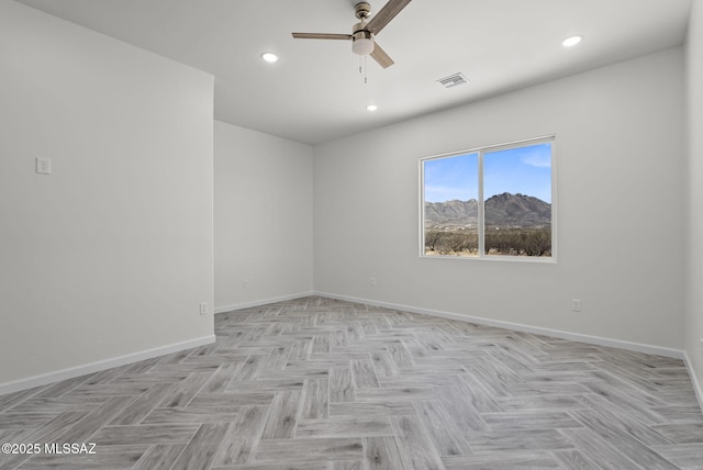 unfurnished room featuring ceiling fan, baseboards, visible vents, and recessed lighting