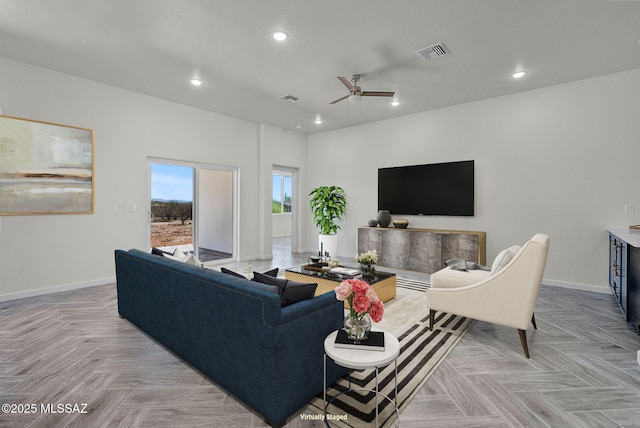 living room featuring baseboards, visible vents, recessed lighting, and ceiling fan