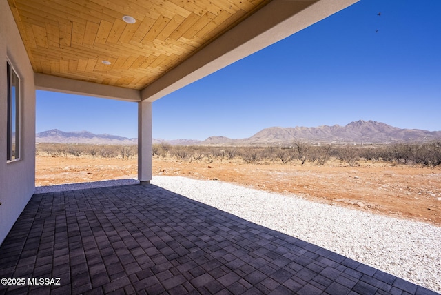 view of patio / terrace with a mountain view