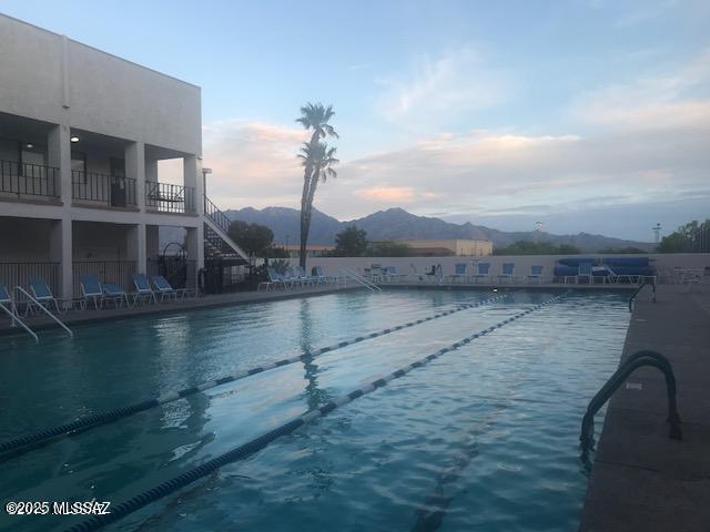 community pool with a mountain view