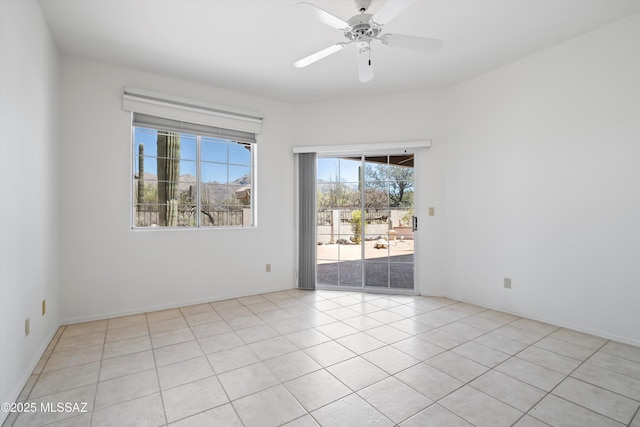 unfurnished room featuring light tile patterned flooring and ceiling fan