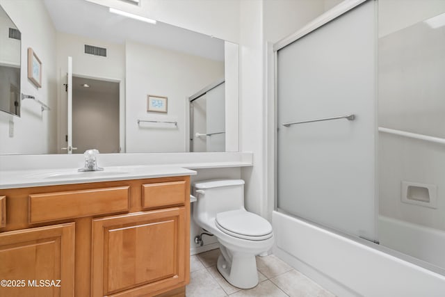 bathroom featuring tile patterned floors, visible vents, toilet, and vanity