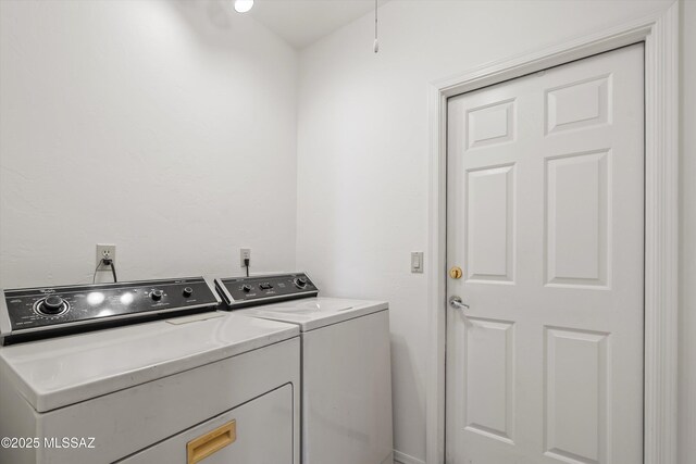 laundry room featuring washer and dryer and laundry area