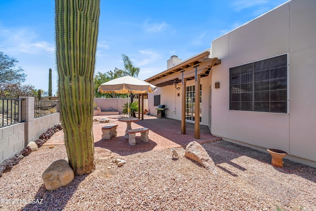 view of yard with a fenced backyard, a patio, and french doors
