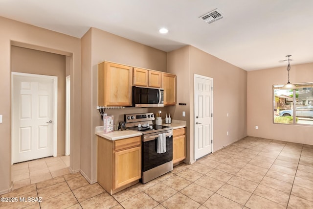 kitchen with stainless steel appliances, light countertops, light tile patterned flooring, visible vents, and light brown cabinets