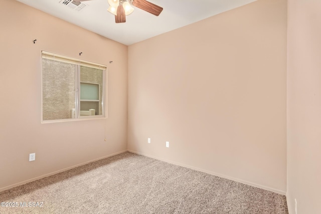 unfurnished room featuring visible vents, carpet flooring, baseboards, and ceiling fan