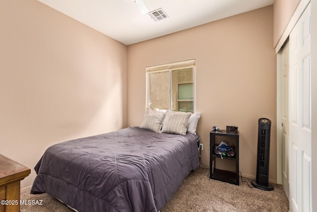 carpeted bedroom with baseboards and visible vents