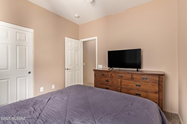 bedroom featuring baseboards and carpet floors