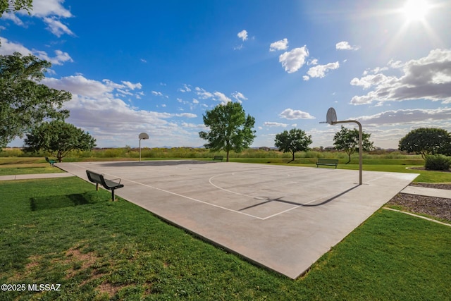 view of basketball court featuring a yard and community basketball court