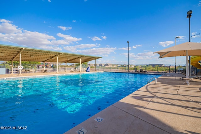 community pool featuring fence