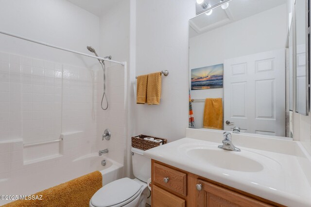 full bathroom with toilet, vanity, and shower / tub combination