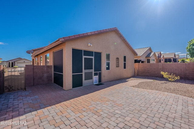back of property featuring a patio area, a fenced backyard, and stucco siding