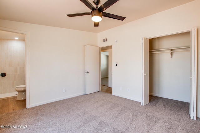 unfurnished bedroom with visible vents, connected bathroom, a closet, baseboards, and carpet flooring