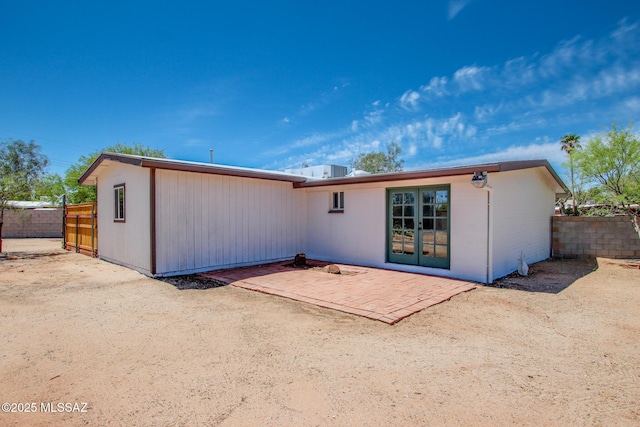 back of house featuring a patio and fence