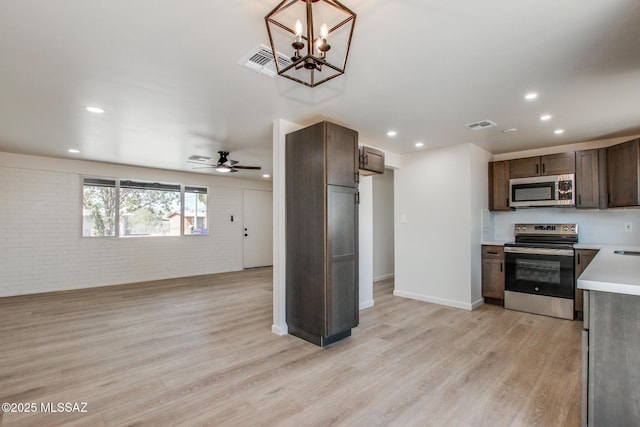 kitchen featuring light countertops, visible vents, recessed lighting, and appliances with stainless steel finishes