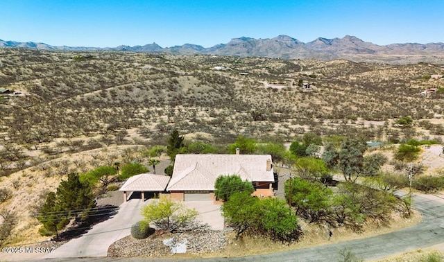 birds eye view of property with a mountain view