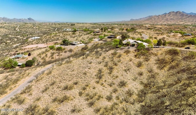 bird's eye view with a mountain view, a rural view, and view of desert